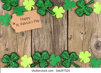 Happy St Patricks Day Tag With Double Border Of Shiny Shamrocks Over A Rustic Wood Background