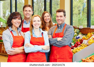 Happy Staff Team With Men And Women In A Supermarket