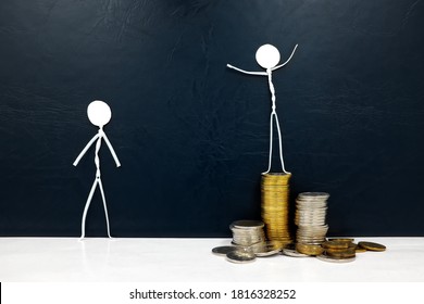 Happy Stick Man Figure Standing On A Pile Of Coins Beside A Sad Envious One. Rich Versus Poor, Wealth Disparity And Income Inequality Concept.