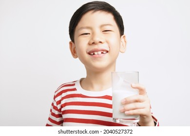 Happy And Strong Asian Little Boy Hold A Glass Of Milk And Cheerful Smiling To Camera. Calcium, Vegan, Plant Milk, Dairy, Lactose Free, Student Boy, 7-8, Whole Milk, Protein Shake, Precious, Love.