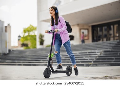 Happy student on scooter outside on fresh air - Powered by Shutterstock