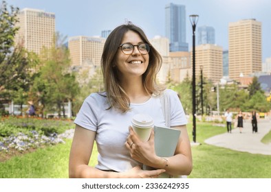 Happy student woman portrait in a big city