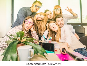 Happy Students Employee Workers Group Taking Selfie With Stick - University Concept Of Human Resource On Working Fun Time - Startupper At College Office - Bright Contrasted Filter With Sunshine Halo