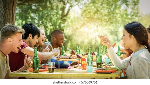 Happy Students Having Barbecue On Summer Day In Backyard Home Garden - Young Cheerful People Eating Tasty Bbq Dinner - Concept About Positive Mood With Friends - Warm Filter