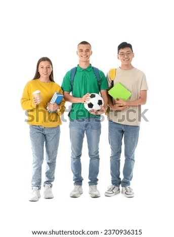 Happy students with soccer ball, cup of coffee and notebooks on white background