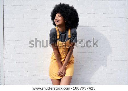 Similar – Image, Stock Photo Black woman, afro hairstyle, on roller skates riding outdoors on urban bridge with open arms.