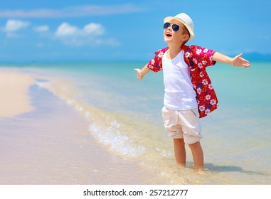 Happy Stylish Boy Enjoys Life On Summer Beach