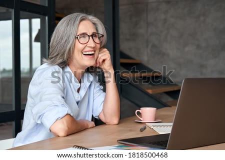 Similar – Image, Stock Photo A middle-aged woman, alone, watches television, looking sad