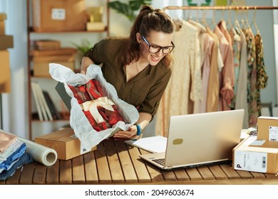 Happy Stylish Middle Aged Small Business Owner Woman In The Office Using Video Chat On Laptop.