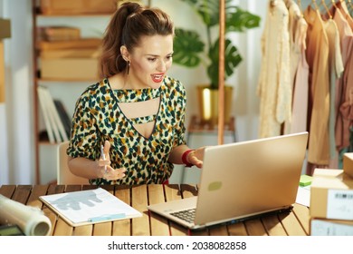 Happy Stylish Small Business Owner Woman In The Office Having Video Chat On Laptop.