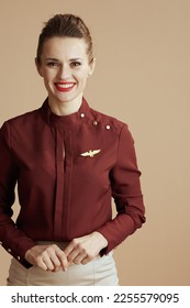 happy stylish stewardess woman on beige background. - Shutterstock ID 2255579095