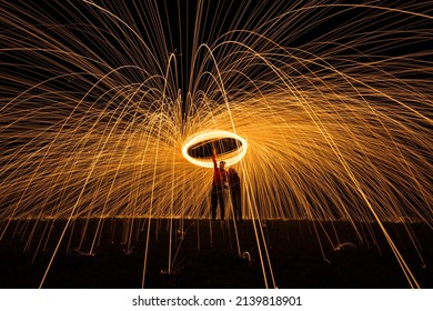 happy stylish woman and men holding aburning sparkler firework bengal light 4k wallpaper