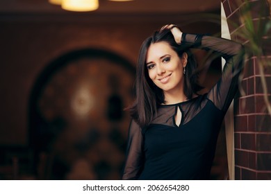 Happy Stylish Woman Wearing A Mesh Top. Beautiful Party Host Looking At The Camera And Smiling
