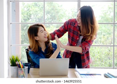 Happy And Successful Asian Business Women Colleagues Giving High Five At Home Office, Co Worker Team Smiling And Making High Five After Finishing Project, Happy Asian Women Friends When Success Work

