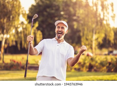 Happy successful man on golf field.  Successful golfer man. 