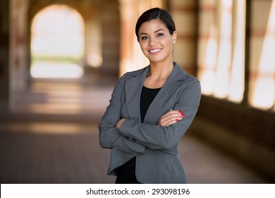 Happy successful smiling business woman executive female in a suit 