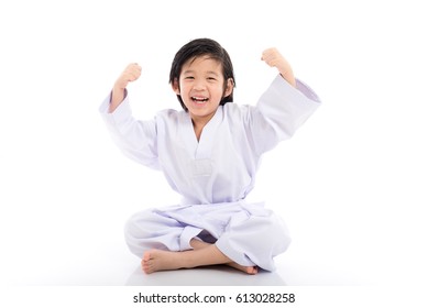 Happy successful winner child in white kimono jumping on white background isolated