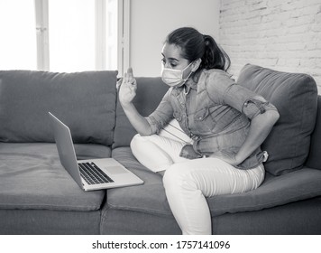 Happy successful woman on laptop working from home. Freelancer or employee in video conference virtual meeting working remotely in COVID-19 lockdown, social distancing and New normal concept. - Shutterstock ID 1757141096