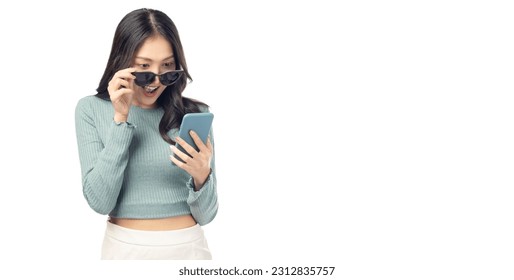 Happy Surprise excited young woman use mobile phone standing over isolated on white background and copy space Young girl using smartphone for shopping online chat and texting message She get surprised - Powered by Shutterstock