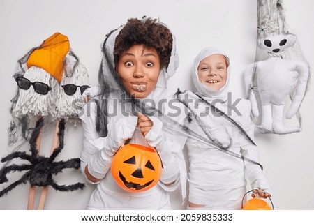 Similar – Foto Bild Happy Halloween.überrascht Kind in einem Skelett-Kostüm mit Popcorn gegen orange Hintergrund