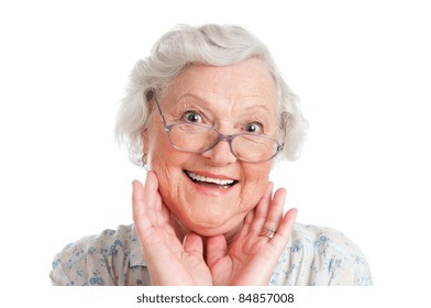 Happy surprised senior woman looking at camera isolated on white background