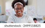 Happy, teacher and portrait of black woman in classroom with confidence in education career. Smile, pride and African female tutor with job in childhood development with face at school academy.