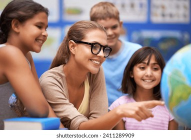 Happy teacher, students and geography with planet or globe of earth in class for education or learning at school. Woman, mentor or educator smile with kids or children with world map in classroom - Powered by Shutterstock