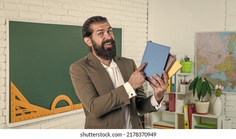 Happy Teacher With Workbook And Books Ready For Lesson, School