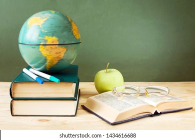 Happy Teacher's Day, Book Pile With Apple And Globe With Copy Space, Still Life