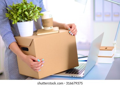 Happy Team Of Businesspeople Moving Office, Packing Boxes, Smiling