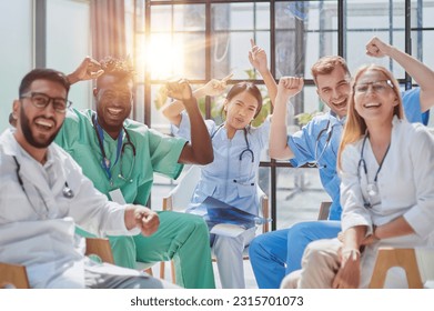 happy team of diverse doctors in hospital lobby. - Powered by Shutterstock