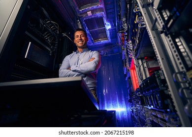 Happy IT Technician Standing In Server Room