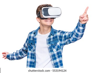 Happy Teen Boy Wearing Virtual Reality Goggles Watching Movies Or Playing Video Games, On White. Cheerful Smiling Looking In VR Glasses And Gesturing With His Hands. Child Experiencing Virtual Reality