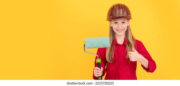 Happy Teen Child In Builder Hard Hat With Paint Roller On Yellow Wall. Thumb Up. Child Builder In Helmet Horizontal Poster Design. Banner Header, Copy Space.