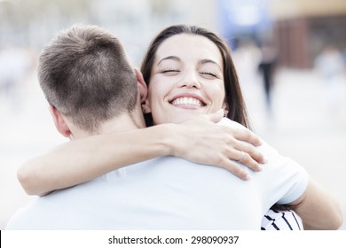 Happy Teen Couple Embracing At Street. Love Concept