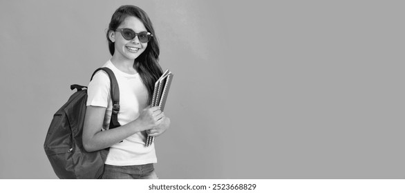 happy teen girl with backpack and copybook in sunglasses ready to study at school. Portrait of schoolgirl student, studio banner header. School child face, copyspace. - Powered by Shutterstock