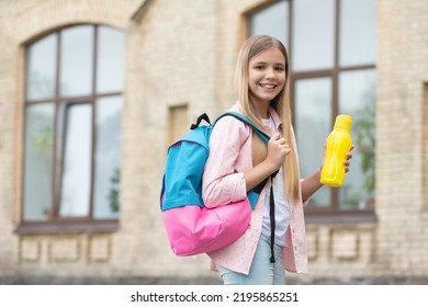 Happy teen girl carrying school bag and water bottle. School education. Informal education - Powered by Shutterstock