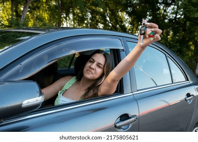 Happy Teen Girl Driver Brag Receiving Driving License And Showing Car Key To The Camera Feeling Happy And In High Spirit. Teenager Has Got Her First Car.