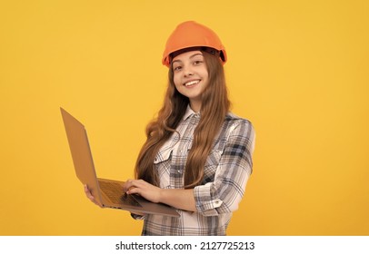 Happy Teen Girl In Helmet And Checkered Shirt Using Laptop, Education Online