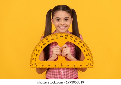 Happy Teen Girl Hold School Math Tool Protractor Ruler On Yellow Background, Geometry