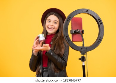 happy teen girl use selfie led. kid beauty blogger. childhood happiness. child do makeup. vlogger with cosmetics. making video blog on smartphone. blogging light lamp. makeup tutorial. influencer.