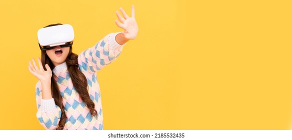 happy teen girl wear vr glasses using future technology for education in virtual reality. Banner of child girl with virtual reality vr headset, studio portrait with copy space.
