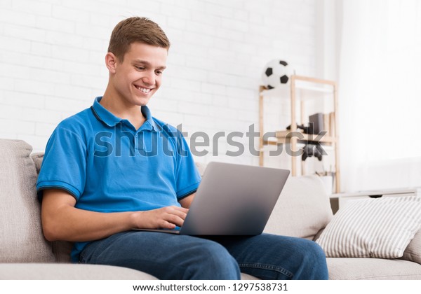 Happy Teen Guy Surfing Internet On Stock Photo Edit Now 1297538731