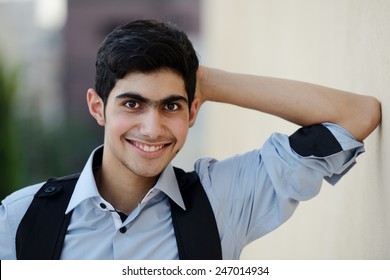 Happy teenage boy posing