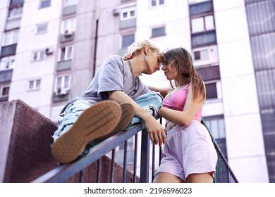 A Happy Teenage Couple Is Cuddling And Hugging In The Urban Part Of The Town.