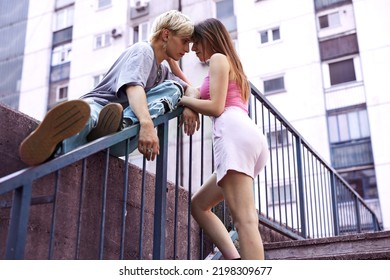 A Happy Teenage Couple Is Cuddling And Hugging In The Urban Part Of The Town.