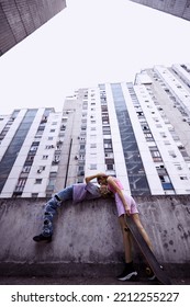 A Happy Teenage Couple Is Cuddling And Hugging In The Urban Part Of The Town.