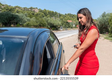 Happy Teenage Female Driver Showing Car Key And Feeling Happy And Cheerful. A Teenage Girl Got Her First Car.