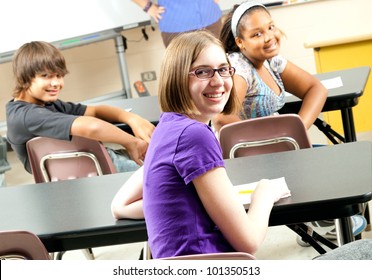 Happy Teenage Middle School Or Highschool Students In Class.