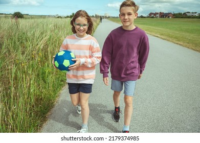 Happy Teenage Siblings Or Friends Joyful Walking At Summer Holidays